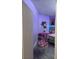 Bedroom with hanging chair and light purple walls at 626 Baldwin Dr, Kissimmee, FL 34758
