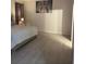 Bedroom with large bed and New York City bridge art at 626 Baldwin Dr, Kissimmee, FL 34758