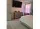 Spacious bedroom with large TV and dresser at 626 Baldwin Dr, Kissimmee, FL 34758