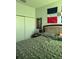 Bedroom with large bed and Dominican Republic flag at 626 Baldwin Dr, Kissimmee, FL 34758