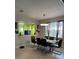 Dining area with a glass-top table and black chairs at 626 Baldwin Dr, Kissimmee, FL 34758