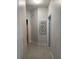 Bright hallway with light gray walls and tile floors at 626 Baldwin Dr, Kissimmee, FL 34758