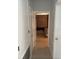 Bright hallway with doors leading to bedrooms at 626 Baldwin Dr, Kissimmee, FL 34758