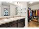 Bathroom with double sinks and walk-in closet at 6364 Domenico Ct, Groveland, FL 34736