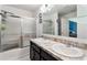 Bathroom with double sinks and shower at 6364 Domenico Ct, Groveland, FL 34736