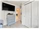 Bedroom with TV, dresser, and closet at 6364 Domenico Ct, Groveland, FL 34736