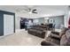 Open concept living and kitchen area with island and dining space at 6364 Domenico Ct, Groveland, FL 34736
