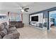 Spacious living room featuring comfortable seating and a built-in entertainment center at 6364 Domenico Ct, Groveland, FL 34736