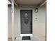 Close-up of the front door with decorative window and house number; features a modern light fixture at 701 N 4Th St, Haines City, FL 33844