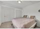 Bedroom with a queen bed and a large closet with louvered doors at 7933 Merrimac Cove Dr, Orlando, FL 32822