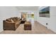 Spacious living room features tile flooring and neutral color palette at 7933 Merrimac Cove Dr, Orlando, FL 32822