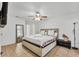 Serene main bedroom with a ceiling fan, white walls, and tiled flooring at 7933 Merrimac Cove Dr, Orlando, FL 32822