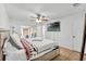 Comfortable main bedroom with a ceiling fan and access to a screened-in patio at 7933 Merrimac Cove Dr, Orlando, FL 32822