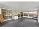 Enclosed sunroom featuring multiple sliding glass doors that lead to outdoor spaces at 7933 Merrimac Cove Dr, Orlando, FL 32822