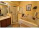 Clean bathroom with shower, tub and vanity at 813 Halifax Dr, Kissimmee, FL 34758