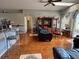 Spacious living room featuring a large TV stand and comfortable seating at 813 Halifax Dr, Kissimmee, FL 34758