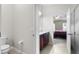 Bathroom with double vanity leading to bedroom at 826 Birch Hollow Dr, Apopka, FL 32703