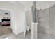 Bathroom featuring a shower and toilet with an open doorway to a bedroom at 8939 Fallen Oak Dr, Davenport, FL 33896