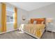 Bedroom features a bright sunny window with yellow accents at 8939 Fallen Oak Dr, Davenport, FL 33896
