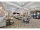Spacious dining room with elegant seating, modern decor, and large windows for natural light at 8939 Fallen Oak Dr, Davenport, FL 33896