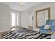 Bright foyer with a striking mirror and chair at 8939 Fallen Oak Dr, Davenport, FL 33896