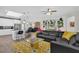 Open-concept living room, seamlessly connects to the modern kitchen and dining area at 8939 Fallen Oak Dr, Davenport, FL 33896