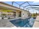 Inviting screened-in pool area featuring a covered seating area and tiled patio at 8939 Fallen Oak Dr, Davenport, FL 33896