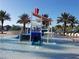 Fun-filled splash pad with a slide and water features in the community pool area at 8939 Fallen Oak Dr, Davenport, FL 33896