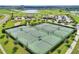 Aerial view of well-maintained tennis courts within the community at 8939 Fallen Oak Dr, Davenport, FL 33896
