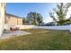 Spacious backyard with lush green grass and white fence, ideal for outdoor activities at 947 Emerald Green Ct, Kissimmee, FL 34746
