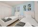 Charming bedroom features twin beds, Mickey Mouse-themed artwork, and bright blue wall at 947 Emerald Green Ct, Kissimmee, FL 34746
