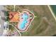 Aerial view of a lovely community pool, outdoor lounge and playground at 947 Emerald Green Ct, Kissimmee, FL 34746