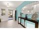 Bright entryway with tiled floor, modern decor, and an open door at 947 Emerald Green Ct, Kissimmee, FL 34746
