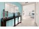 Bright foyer with console table and view to the connected living area at 947 Emerald Green Ct, Kissimmee, FL 34746