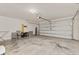 Spacious garage with high ceilings, offering plenty of storage and parking space at 947 Emerald Green Ct, Kissimmee, FL 34746