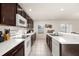 Efficient kitchen layout with modern appliances and ample counter space at 947 Emerald Green Ct, Kissimmee, FL 34746