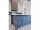 Spacious kitchen island with custom cabinets, elegant details, and a white countertop at 0 Orangewood Ave, St Cloud, FL 34772