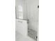 Modern bathroom shower with glass enclosure and pebble tile flooring at 0 Orangewood Ave, St Cloud, FL 34772
