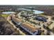 Aerial view of community featuring a resort-style pool, clubhouse, and serene lakes, offering luxurious living at 113 Kenny Blvd, Haines City, FL 33844