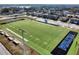 Aerial view of the well-maintained community football field with stadium seating at 113 Kenny Blvd, Haines City, FL 33844