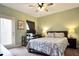 Bedroom featuring a ceiling fan, study space, and outdoor access at 113 Kenny Blvd, Haines City, FL 33844