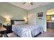 Inviting bedroom with a cozy bed, closet, and access to a bathroom at 113 Kenny Blvd, Haines City, FL 33844