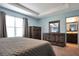 Bedroom with natural light, ensuite, and coordinating rustic furnishings at 113 Kenny Blvd, Haines City, FL 33844