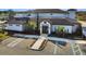 Exterior of clubhouse with a parking lot in front of an event center with lush landscaping at 113 Kenny Blvd, Haines City, FL 33844