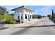 View of the entrance to the Balmoral Resort featuring a gatehouse and landscaped median at 113 Kenny Blvd, Haines City, FL 33844