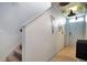 Hallway with staircase and tiled floor, decorated with wall art and festive decor at 113 Kenny Blvd, Haines City, FL 33844
