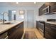 Modern kitchen with stainless steel appliances, and an island with a sink at 113 Kenny Blvd, Haines City, FL 33844