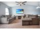 Comfortable living room with cozy furniture and a large TV at 113 Kenny Blvd, Haines City, FL 33844