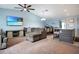 Comfortable living room with plush seating, a ceiling fan, and an open concept layout at 113 Kenny Blvd, Haines City, FL 33844