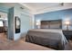 Comfortable main bedroom featuring a spacious layout, tray ceiling, and en-suite bathroom at 113 Kenny Blvd, Haines City, FL 33844